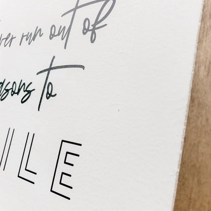 Never Run Out of Reasons to Smil Wood Sign