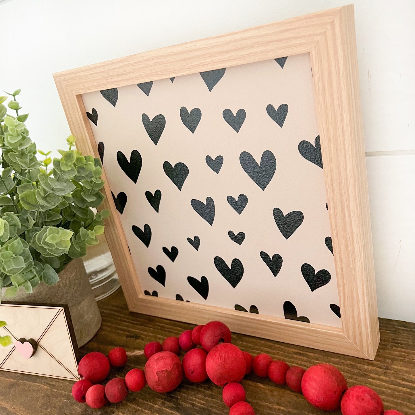 Black Hearts Background Layering Sign